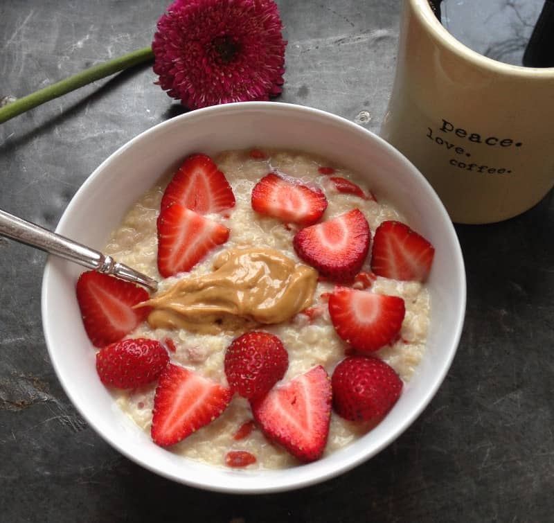 5 minute hot quinoa cereal in a bowl with strawberries