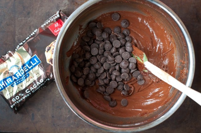 Adding in chocolate chips to brownie batter
