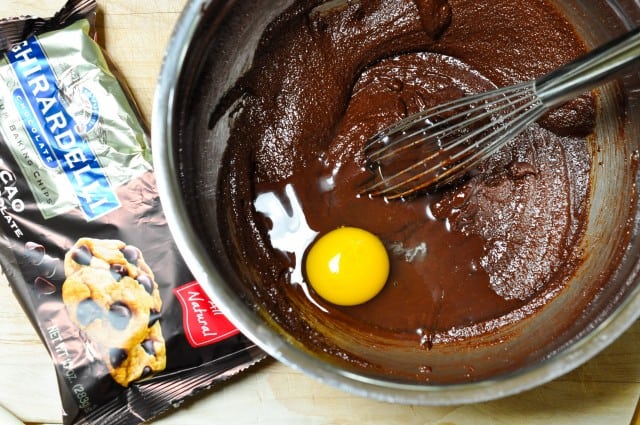 adding egg to chocolate mixture