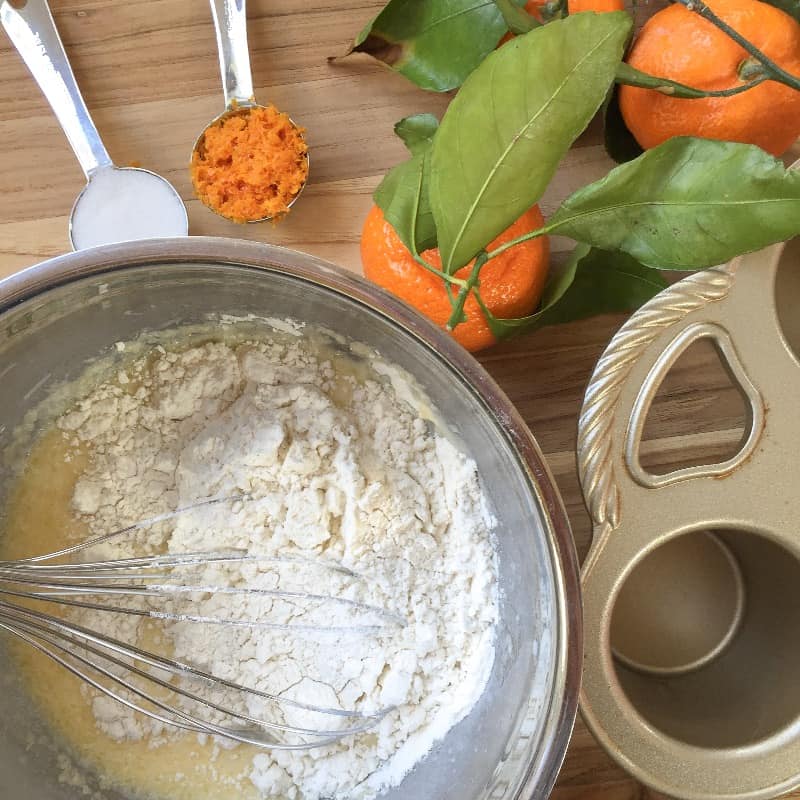 Adding the flour and salt to the orange popovers