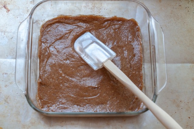 Almond butter brownies in a pan with spatula