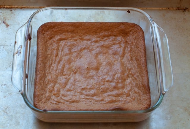 Almond butter brownies baked in a glass pan