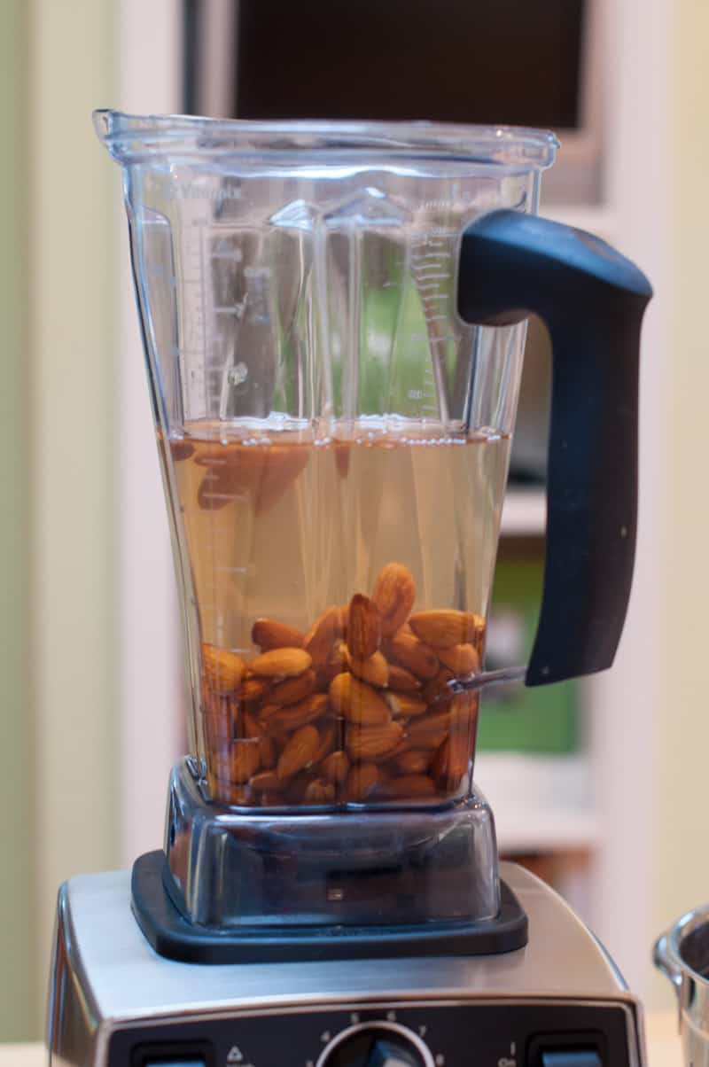 Almonds water and vanilla in blender