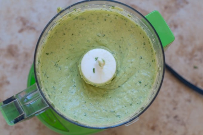 Avocado and tahini in food processor mixed smooth