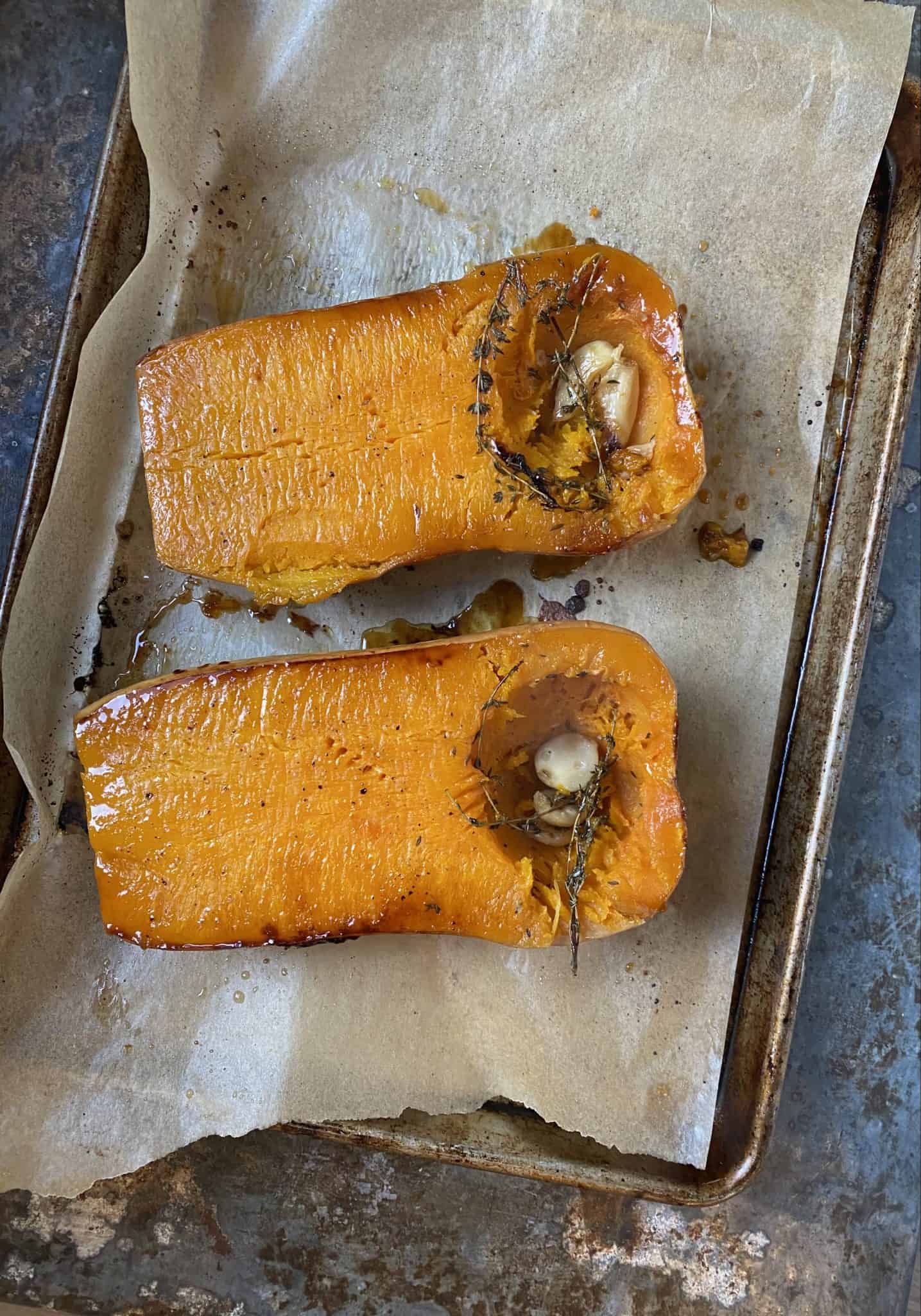 Cooked butternut squash on baking sheet