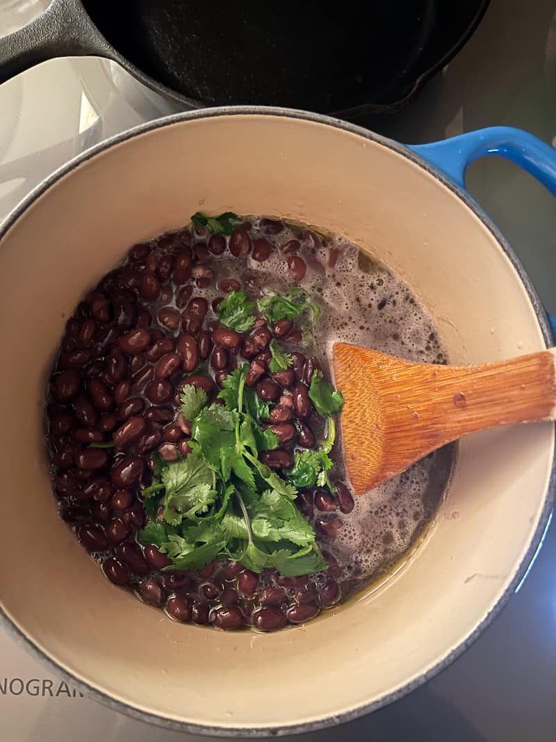 Black beans cooking with cilantro
