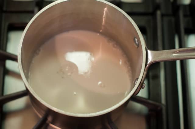 bringing almond milk to a boil