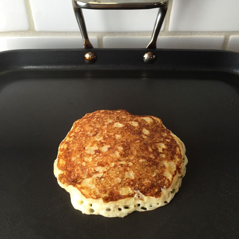 Browned oatmeal pancake on the griddle