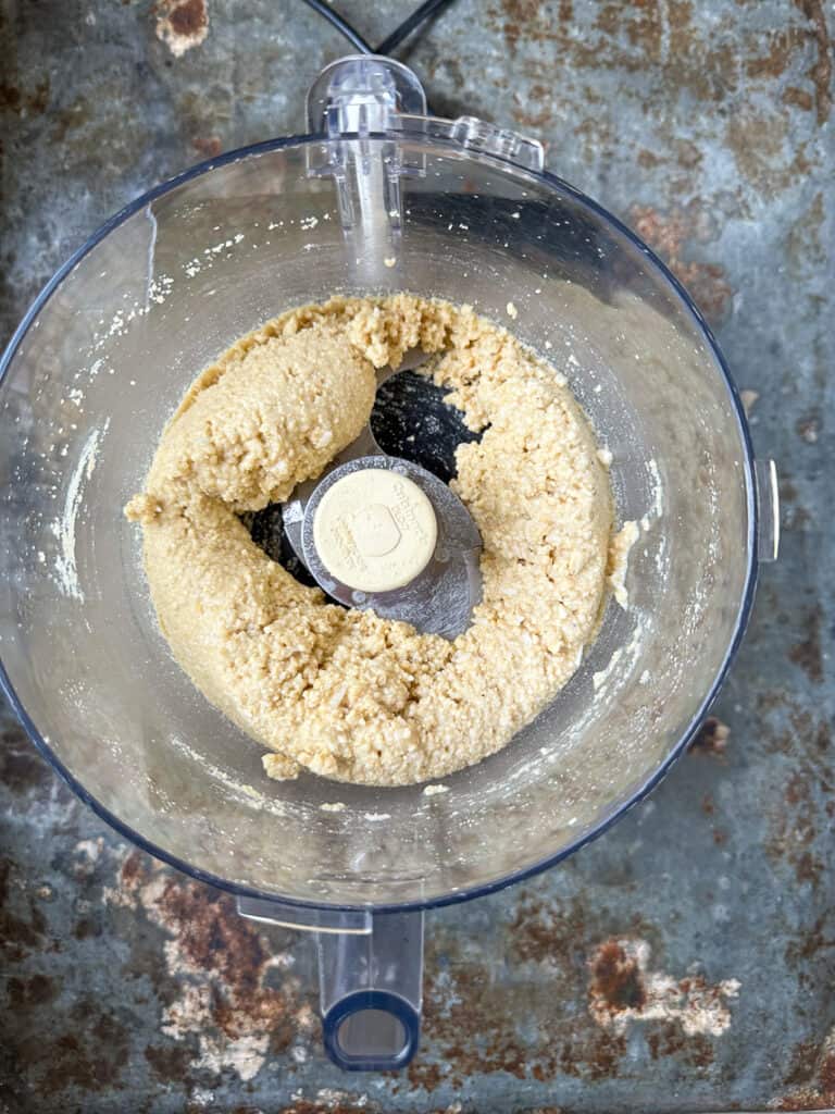 Cashews, coconut oil, almond flour and shredded coconut processed in food processor.