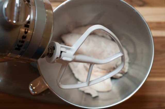 Chicken in a mixer before mixing