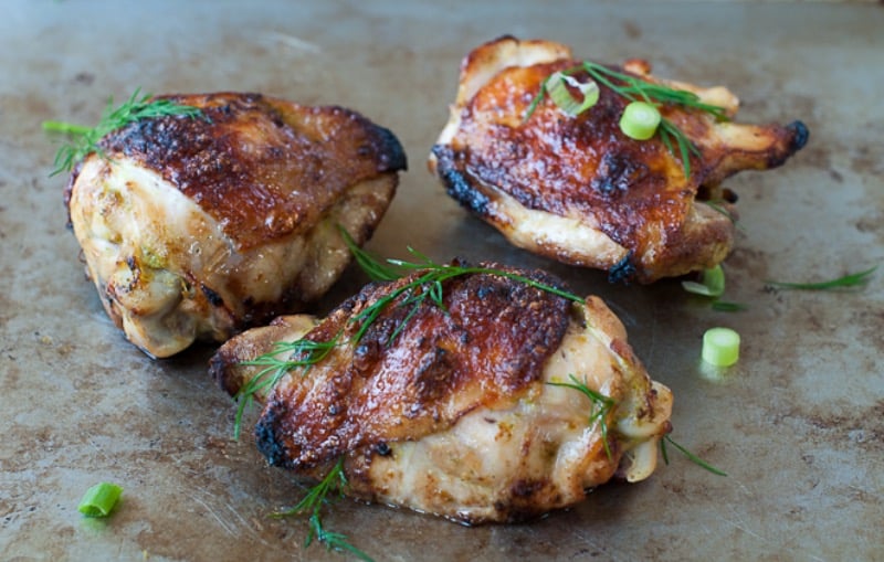 Citrus marinaded chicken- three pieces on the table.