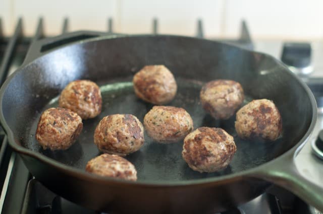 Cooked turkey meatballs in skillet