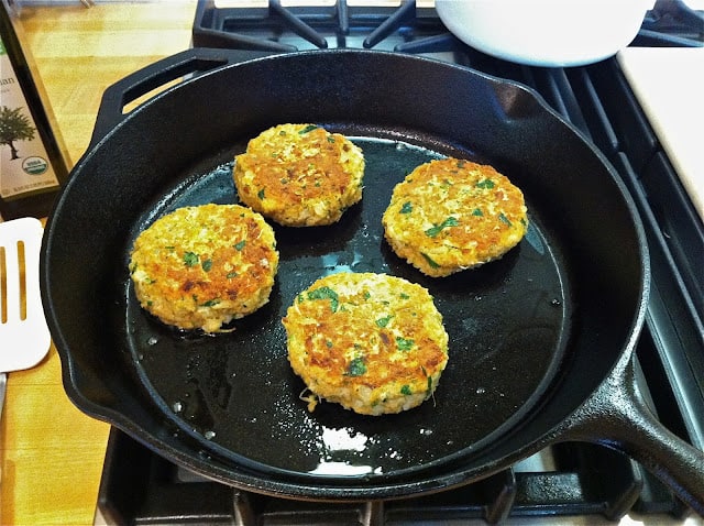 Chickpea burgers cooking in skillet