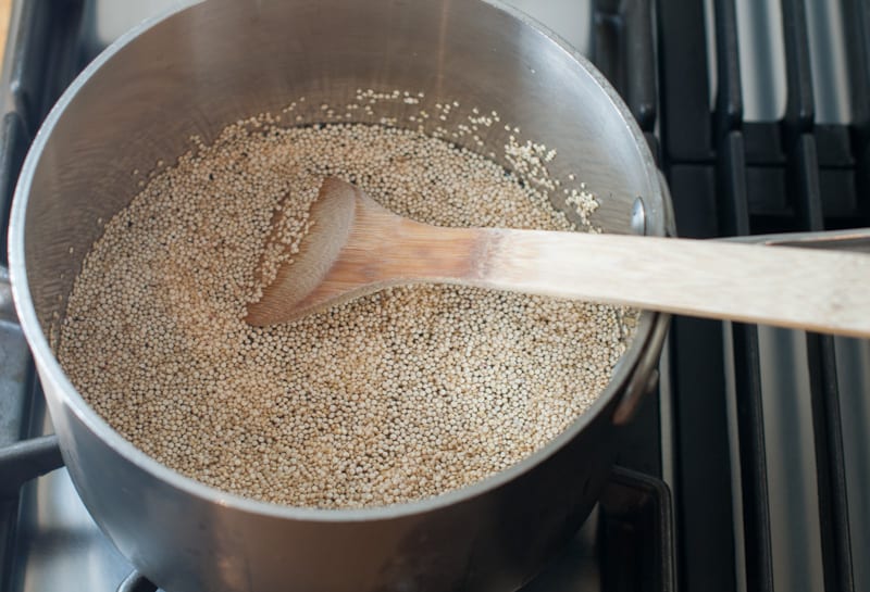 Cooking the quinoa in a pot on the stove