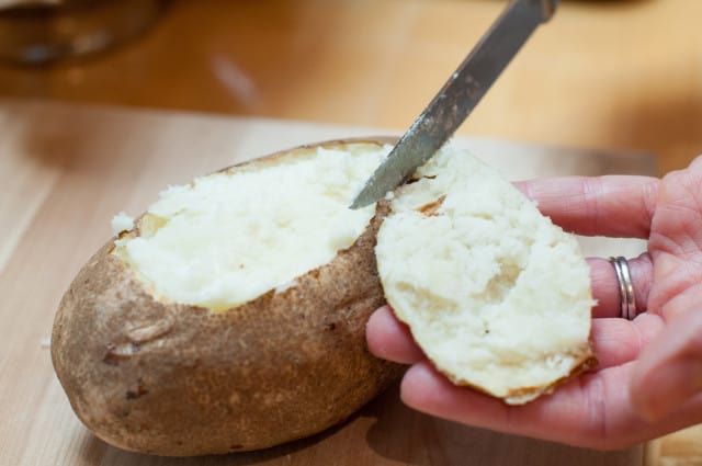 Cut tops off baked potato