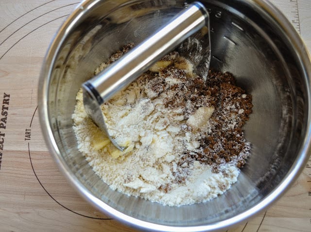 Cutting butter into topping ingredients