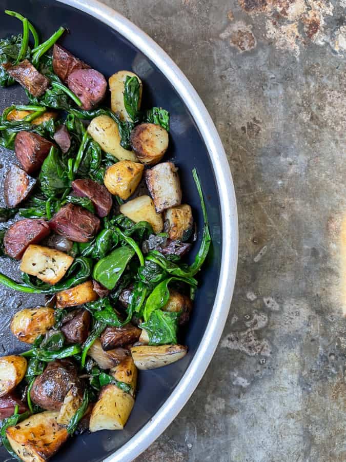 Left over roasted potatoes with sauteed spinach