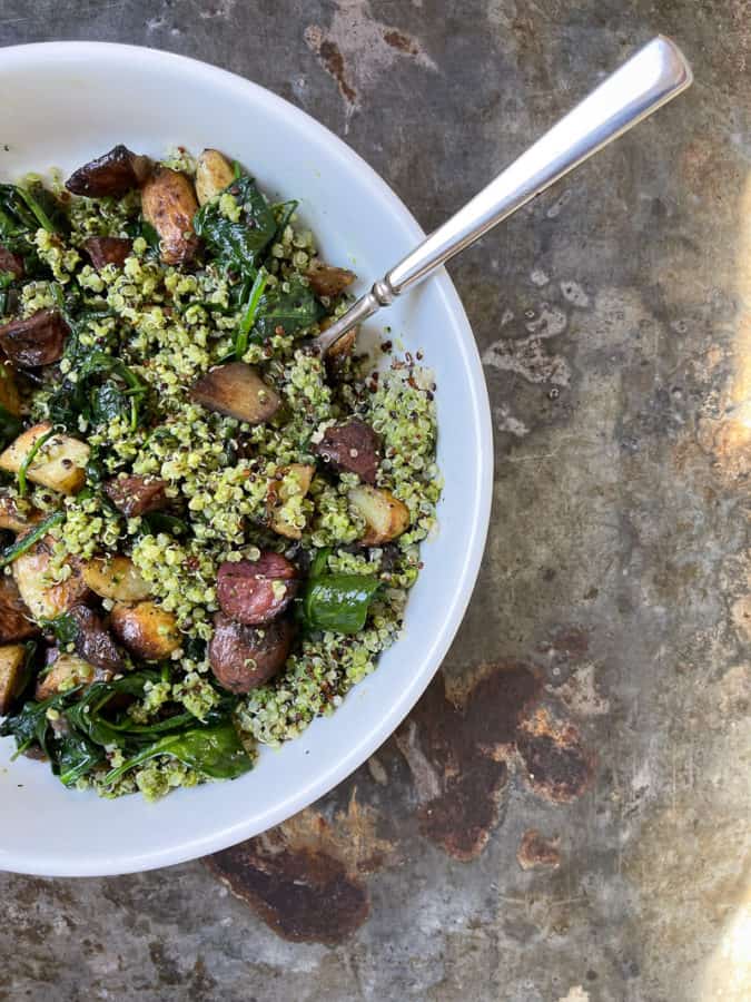 Oven roasted potatoes with sauteed spinach and pesto quinoa