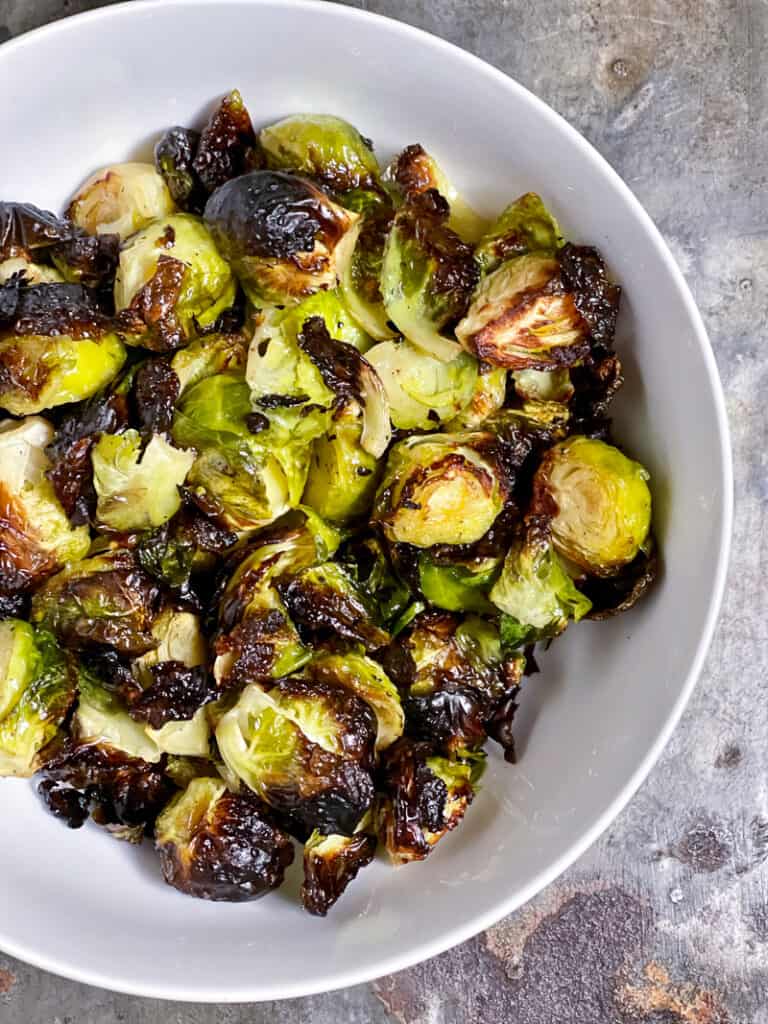 Easy roasted Brussels sprouts in a white bowl