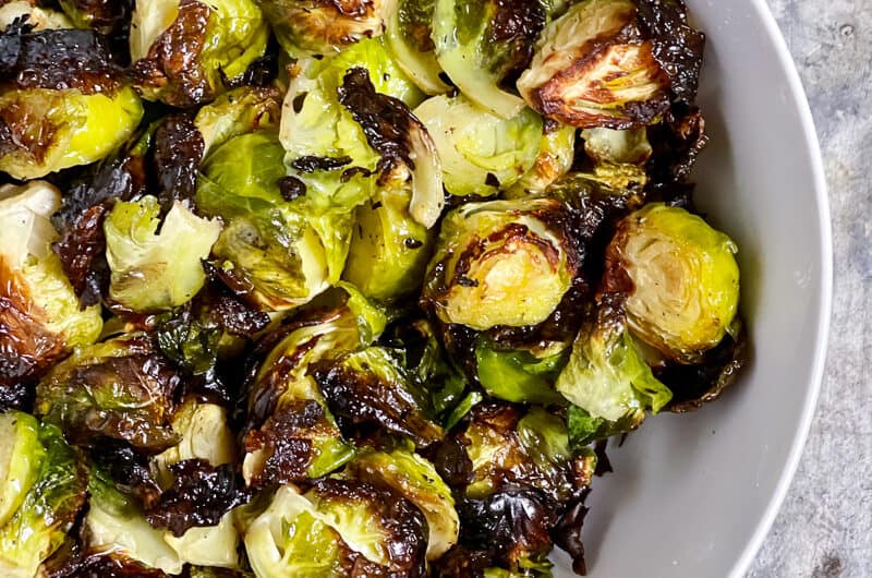 Easy roasted Brussels sprouts in a white bowl