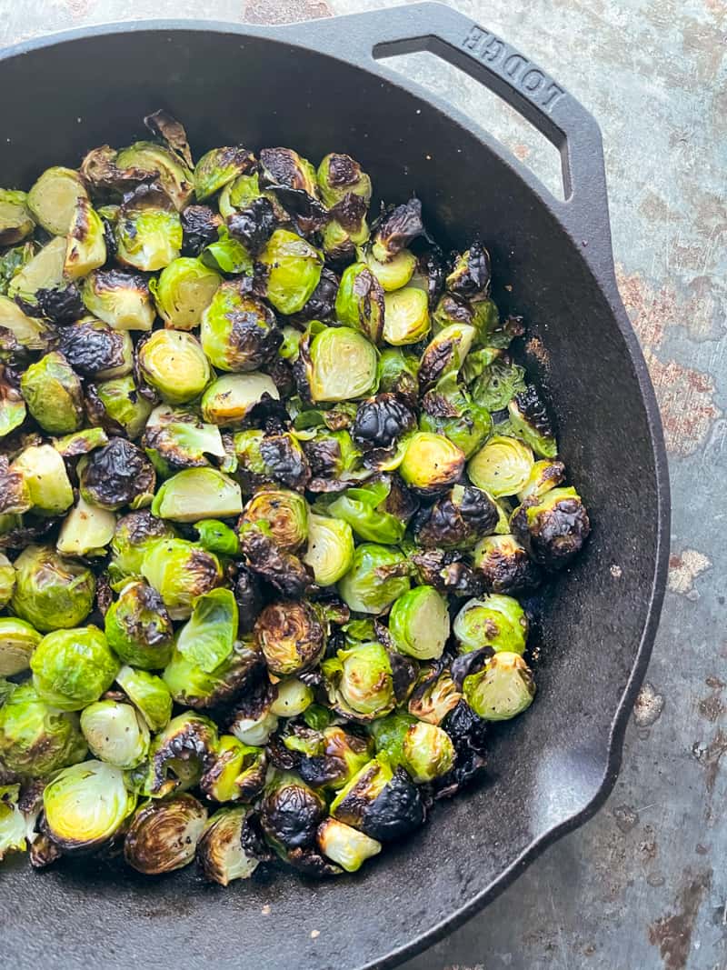 Roasted brussels sprouts in a cast iron skillet 