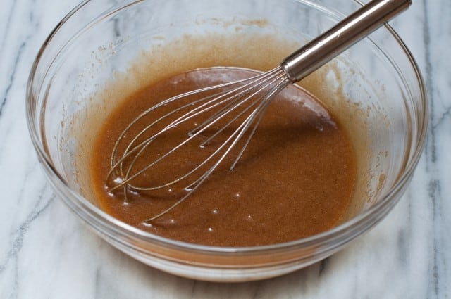 Egg sugar vanilla in a bowl with whisk