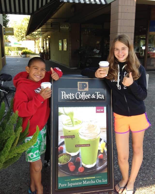 Eli and Zoe with Peet's Coffee sign