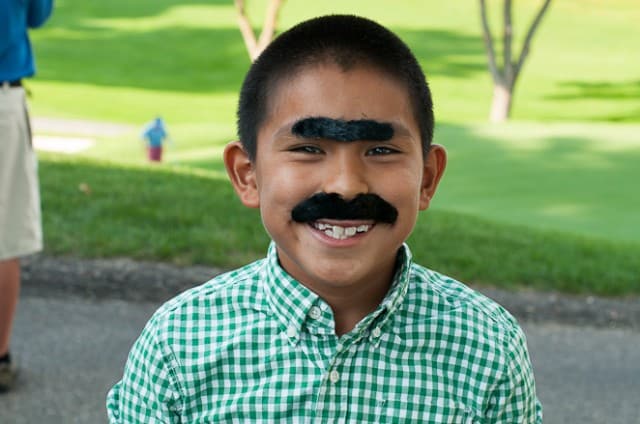 Eli with fake mustache and fake unibrow