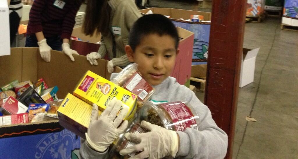 Eli helping out at food bank