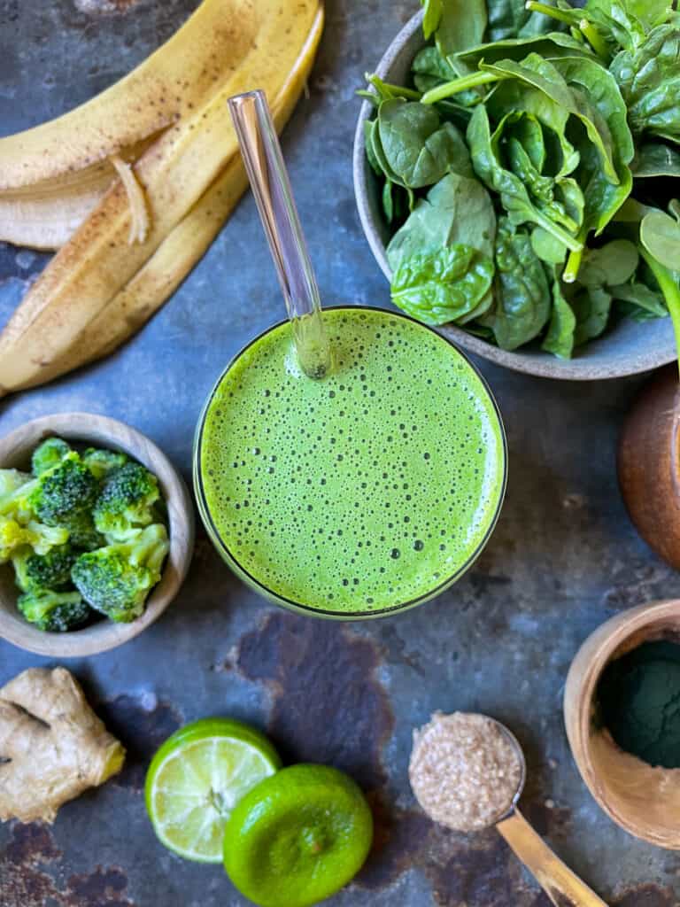 Green ginger smoothie in a glass. 