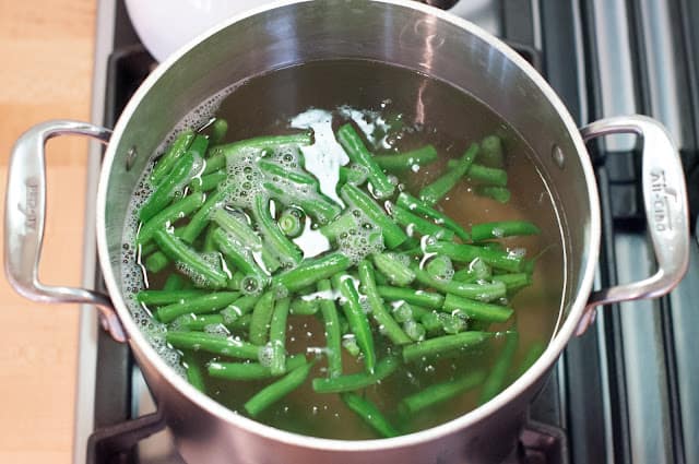 Green beans in pot with pasta