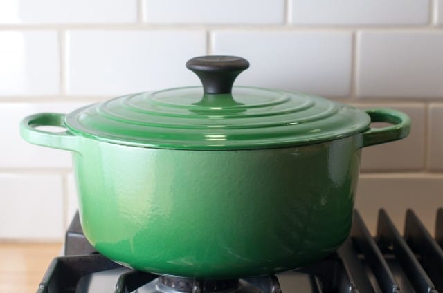 green dutch oven on stove