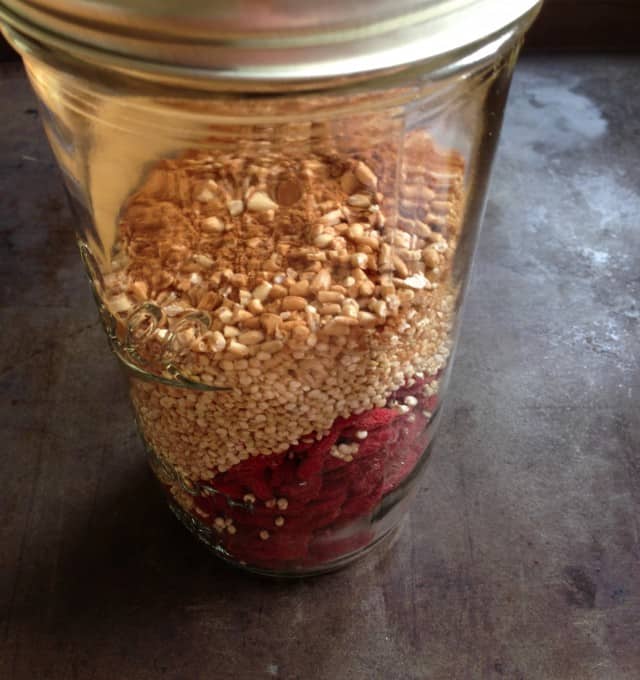 hot quinoa oat cereal with goji berries in a jar