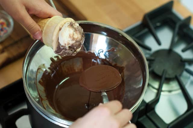 Pouring chocolate over ice cream
