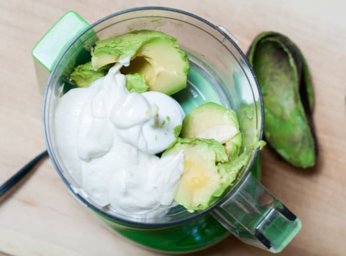 Ingredients for avocado yogurt crema in food processor