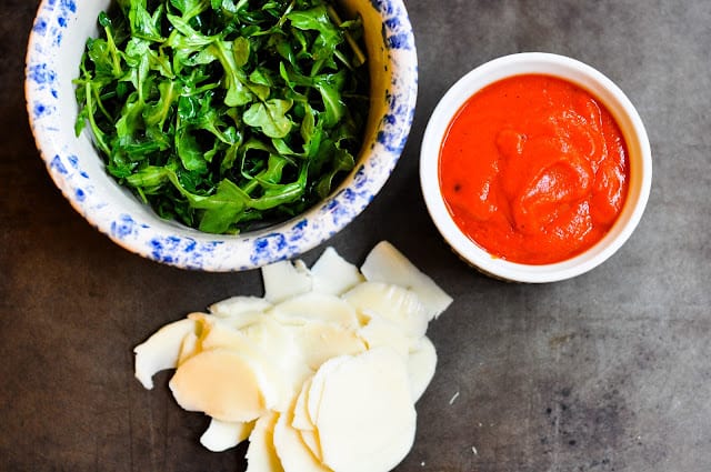 Ingredients for roasted red pepper and arugula whole wheat pizza