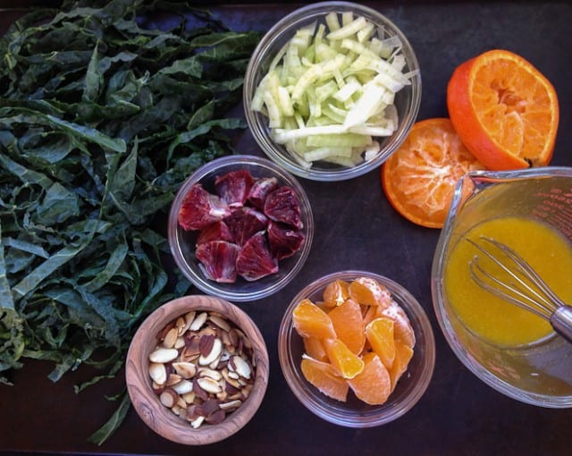 Ingredients for vegan kale salad with citrus dressing.