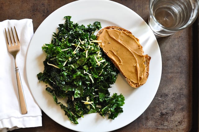 Kale salad and peanut butter toast on plate