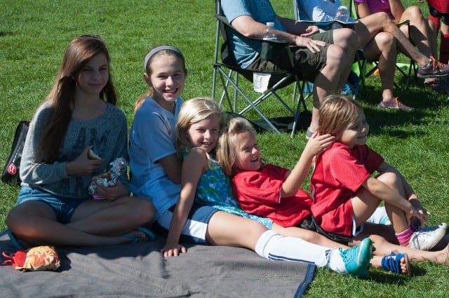 Kids hanging out at soccer game