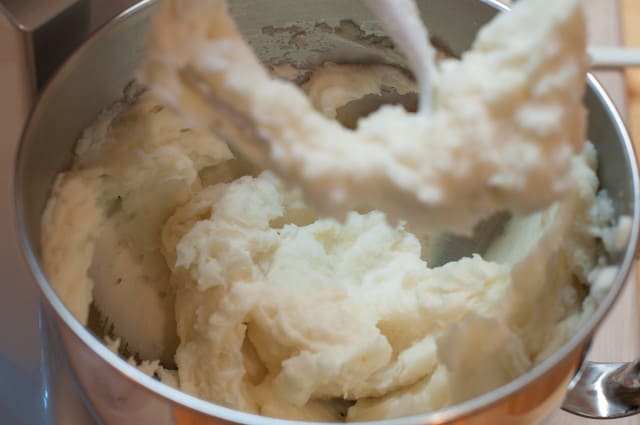 Mixing twice baked potato filling