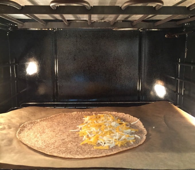 Tortilla melting cheese in broiler