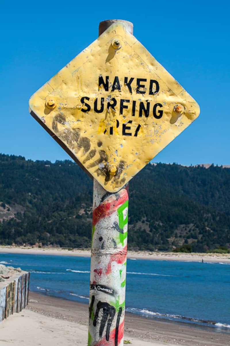 Naked surfer sign