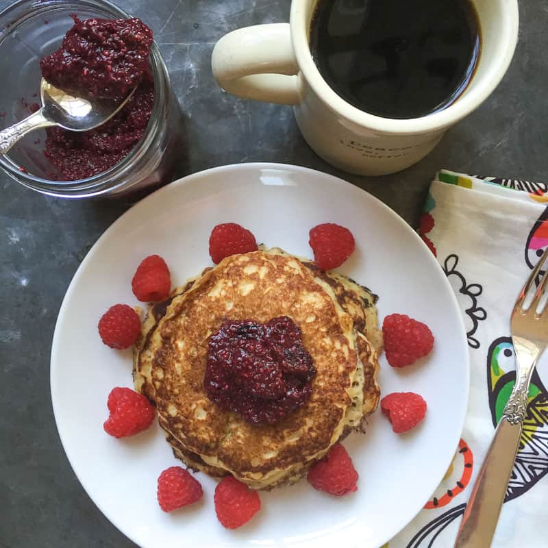 Oatmeal pancakes on a plate with raspberries 