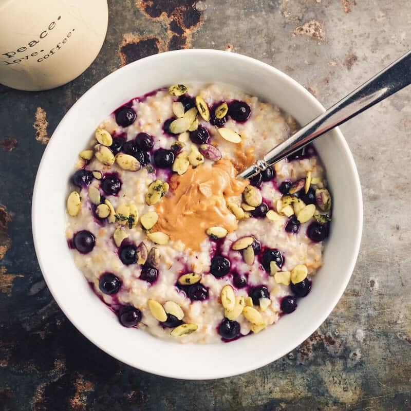 overnight steel cut oats with frozen blueberries and nut butter