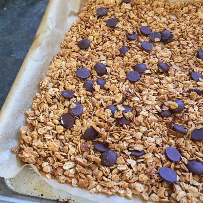 Peanut butter chocolate chip granola on baking sheet