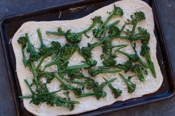 Pizza topped with broccoli rabe