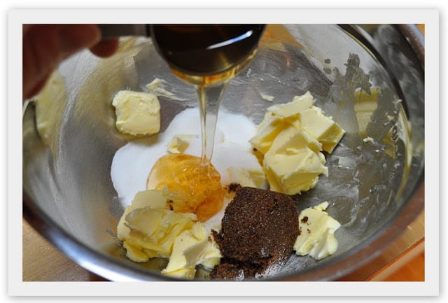 Pouring honey into graham cracker ingredients