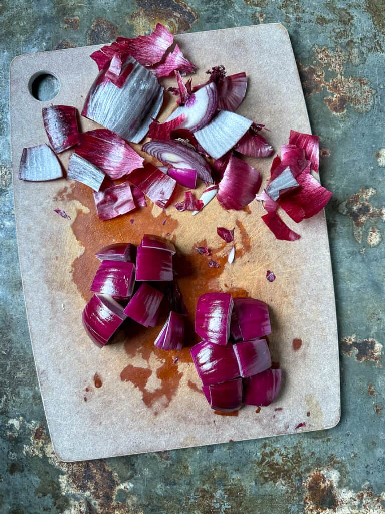 Red onion cut into wedges.