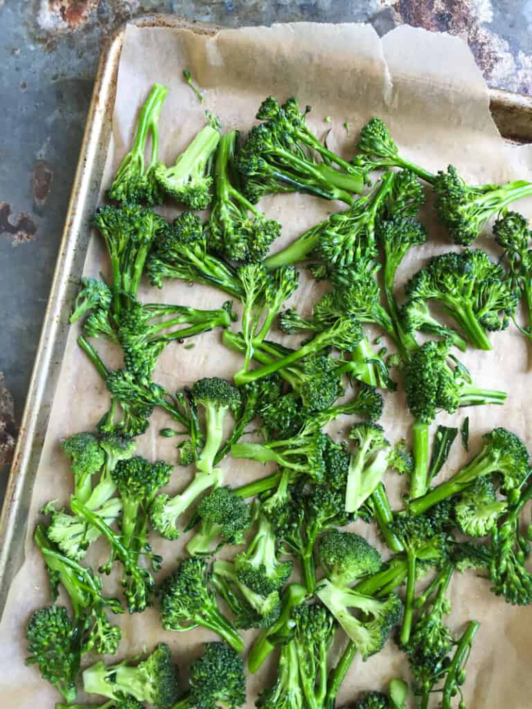 Roasted broccoli on baking sheet