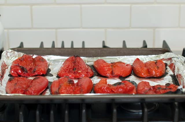 Roasted red peppers on baking sheet
